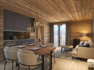This stunning apartment boasts a modern kitchen with dark gray cabinets and wooden accents, seamlessly flowing into a cozy living area with a light beige sofa and wooden flooring.
