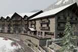 Nestled in a snow-covered mountainside, this stunning hotel boasts a rustic-chic design with stone and wood accents.