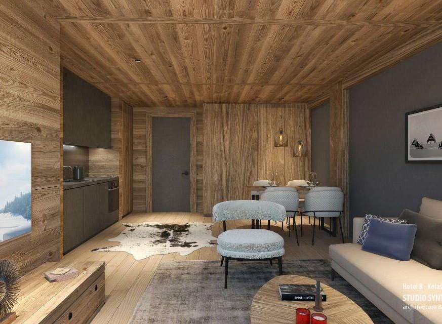 This stunning hotel room boasts a cozy and modern design, featuring a blend of natural wood and sleek gray accents.