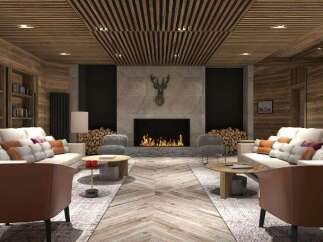 This stunning hotel lobby boasts a cozy and elegant atmosphere, featuring a beautiful fireplace as the centerpiece.