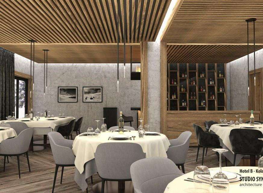 This stunning restaurant boasts a modern design with a rustic touch, featuring a wood slat ceiling and concrete walls.