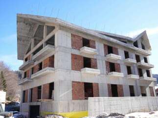 This stunning multi-level building boasts a modern architectural design with a unique sloped roofline.