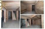 This stunning property boasts a beautifully finished basement with wood paneling on the walls and ceilings, creating a warm and inviting atmosphere.