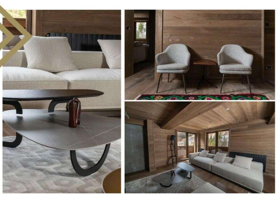 This stunning property boasts a spacious living area with comfortable sofas and armchairs, perfect for relaxing after a day of outdoor activities.