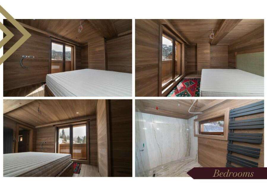 These luxurious bedrooms boast stunning mountain views and are finished with rich wood paneling.