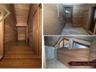 This luxurious master bathroom boasts stunning wood paneling, creating a warm and inviting atmosphere.