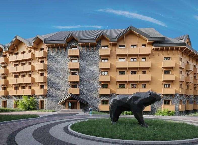 This stunning hotel boasts a unique architectural design, blending natural stone and wood for a cozy yet modern aesthetic.