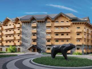 This stunning hotel boasts a unique architectural design, blending natural stone and wood for a cozy yet modern aesthetic.