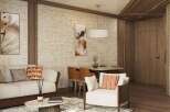 This stunning living space boasts a sophisticated design with a neutral color palette, complemented by pops of orange in the throw pillows.