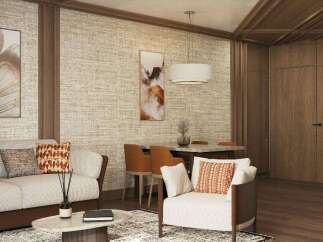 This stunning living space boasts a sophisticated design with a neutral color palette, complemented by pops of orange in the throw pillows.