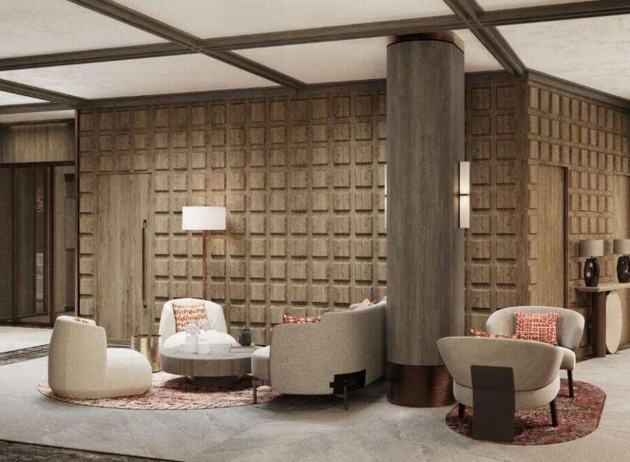 This stunning hotel lobby boasts a sophisticated design with a wood-paneled feature wall, plush seating areas, and a striking central column.