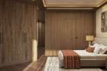 This luxurious bedroom boasts a stunning wood-paneled wall, complemented by a plush bed with a textured throw.
