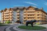 This stunning hotel boasts a unique architectural design, blending natural stone and wood for a cozy yet modern aesthetic.