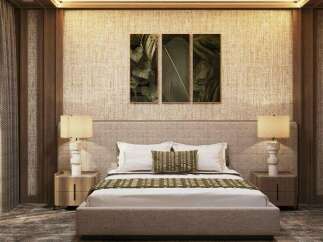 This luxurious bedroom boasts a sophisticated design with a beige woven headboard, complemented by stylish lamps and nightstands.