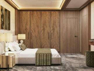 Luxury bedroom with a king-size bed, wooden closet, and nightstands.