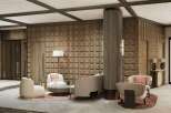 This stunning hotel lobby boasts a sophisticated design with a wood-paneled feature wall, plush seating areas, and a striking central column.