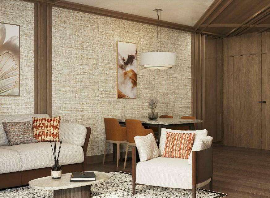 This stunning living space boasts a sophisticated design with a neutral color palette, complemented by pops of orange in the throw pillows.