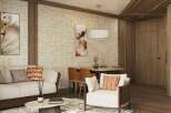 This stunning living space boasts a sophisticated design with a neutral color palette, complemented by pops of orange in the throw pillows.