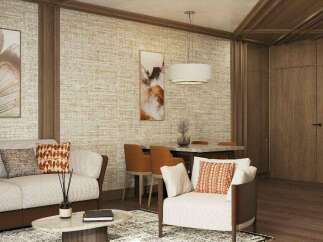 This stunning living space boasts a sophisticated design with a neutral color palette, complemented by pops of orange in the throw pillows.