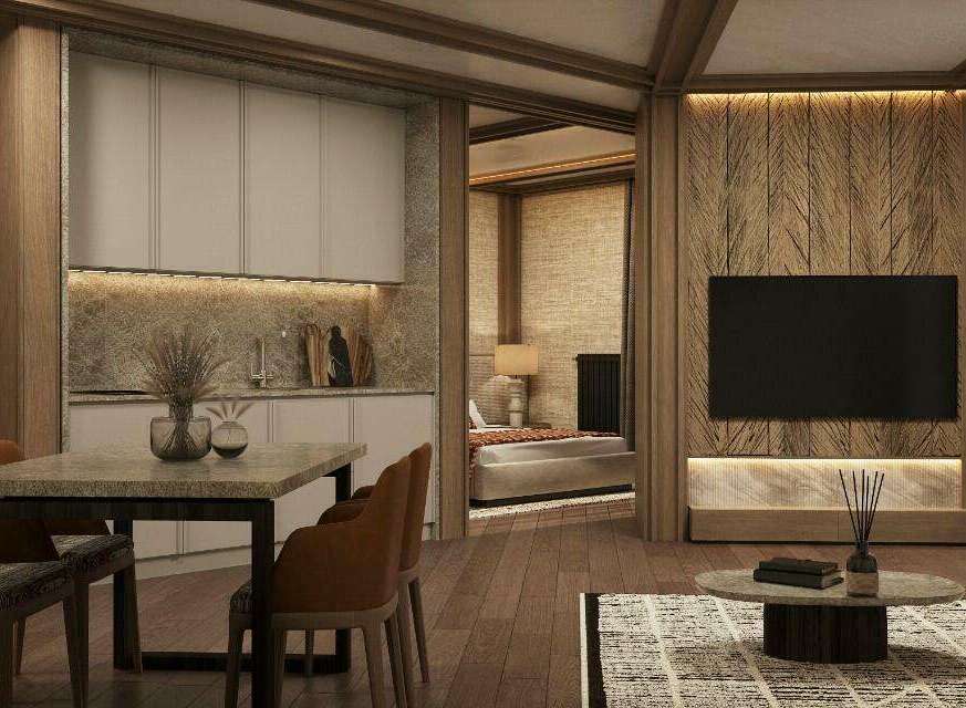 This stunning apartment boasts a modern kitchen with sleek cabinetry and granite countertops, seamlessly flowing into a cozy living area with a large flat-screen TV and stylish wooden wall accents.