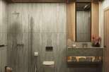 This luxurious bathroom boasts a serene atmosphere with its natural stone wall tiles and wooden accents.
