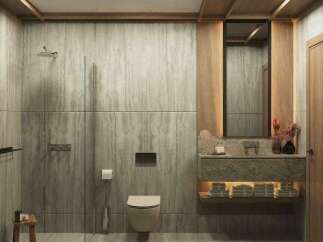 This luxurious bathroom boasts a serene atmosphere with its natural stone wall tiles and wooden accents.