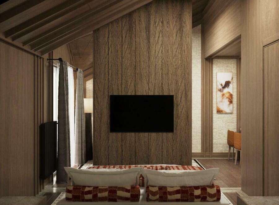 This luxurious hotel room boasts a stunning wooden interior with a herringbone patterned wall, creating a warm and inviting atmosphere.