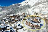Nestled in a charming snow-covered village, this stunning ski resort offers breathtaking mountain views.