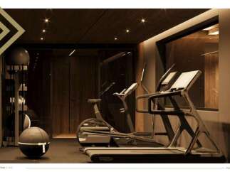 This luxurious property boasts a state-of-the-art home gym, featuring top-of-the-line equipment such as treadmills and stationary bikes.