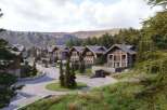 Discover luxurious chalet-style homes nestled in a serene mountain setting.