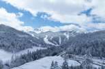 Discover the breathtaking beauty of this snow-covered mountain landscape, perfect for a serene winter getaway.