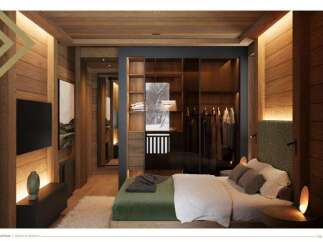 This stunning bedroom boasts a walk-in closet with glass doors, showcasing ample storage space.