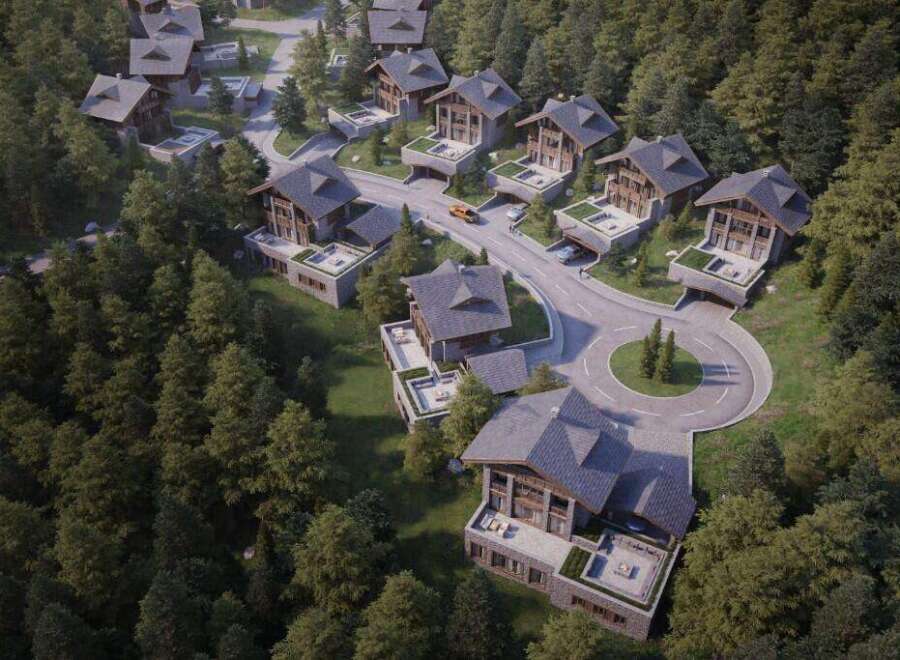 Nestled in a lush forest, this exclusive development offers stunning chalet-style homes with private terraces and underground parking.