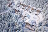 Discover luxurious chalet living nestled in a snowy forest.
