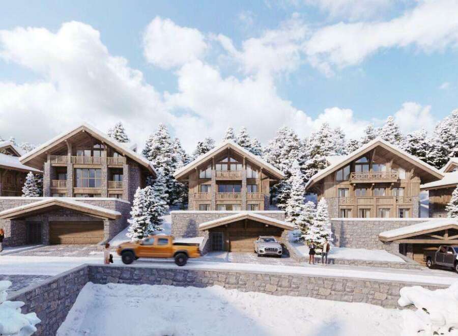Luxury chalet-style homes nestled in a snowy mountain setting, offering stunning views and ample parking.