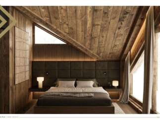 This stunning master bedroom boasts a cozy and luxurious design, featuring a wood-paneled ceiling and walls, creating a warm and inviting atmosphere.