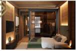 This stunning bedroom boasts a walk-in closet with glass doors, showcasing ample storage space.