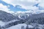 Discover the breathtaking beauty of this snow-covered mountain landscape, perfect for a serene winter getaway.