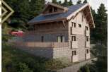 This stunning chalet boasts a unique blend of wood and stone, offering breathtaking views of the surrounding forest.