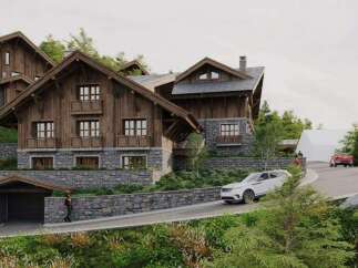 Luxury chalet nestled in the mountains, boasting stunning architecture and breathtaking views.