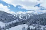 Discover the breathtaking beauty of this snow-covered mountain landscape, perfect for a serene winter getaway.