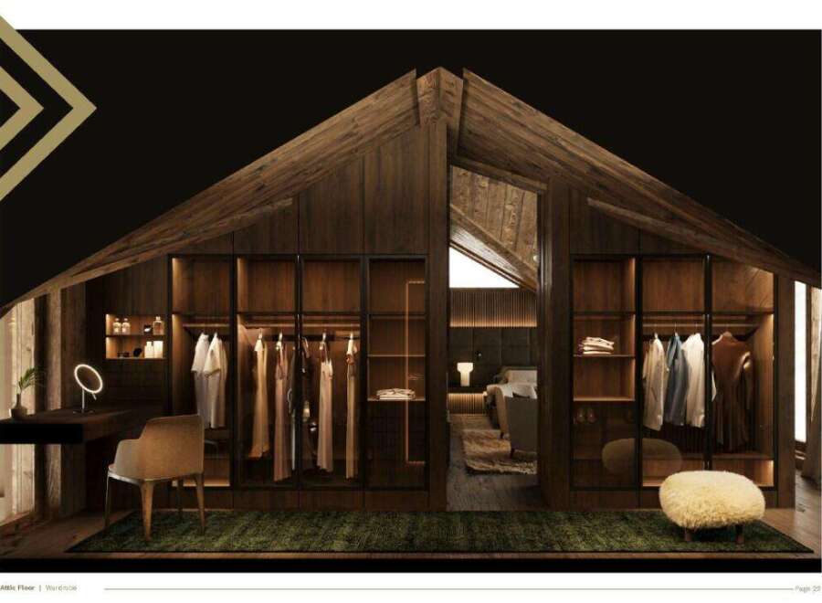 This stunning attic floor boasts a spacious walk-in wardrobe, seamlessly integrated into the sloped ceiling design.