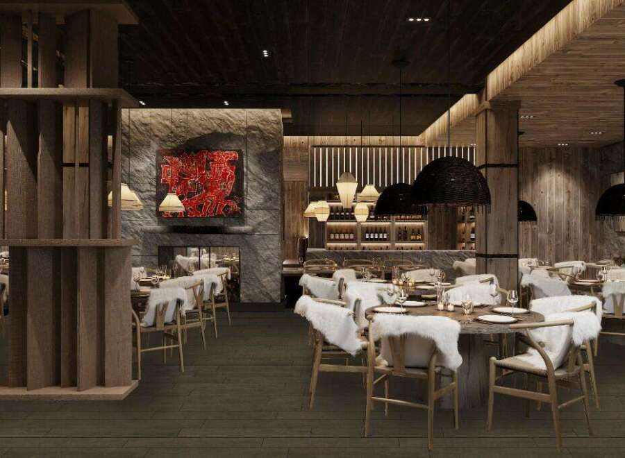 This stunning restaurant boasts a rustic-chic design with exposed wood beams, a stone fireplace, and plush fur accents.