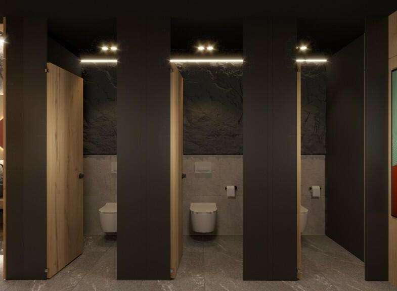 Modern restroom design with sleek dark gray partitions, wood-paneled doors, and stylish geometric artwork.
