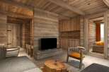 This stunning wooden chalet boasts a spacious open-plan living area with a cozy seating arrangement and a large flat-screen TV.