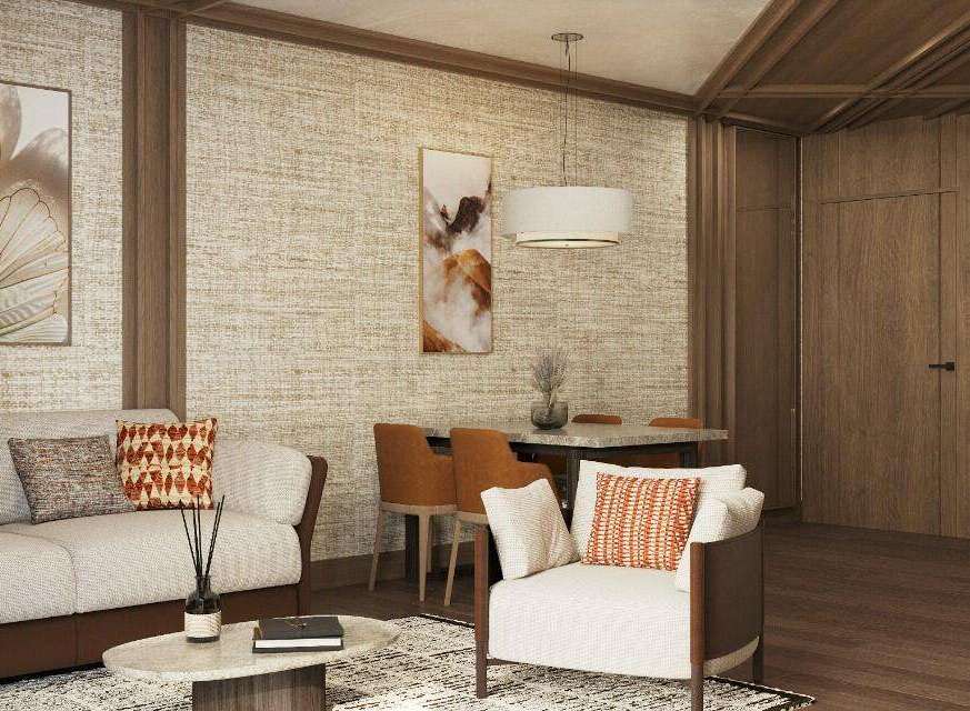 This stunning living space boasts a sophisticated design with a neutral color palette, complemented by pops of orange in the throw pillows.