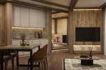 This stunning apartment boasts a modern kitchen with sleek cabinetry and granite countertops, seamlessly flowing into a cozy living area with a large flat-screen TV and stylish wooden wall accents.