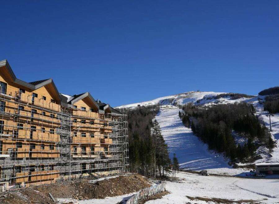This stunning ski resort property boasts breathtaking mountain views and modern architectural design.