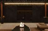 Indulge in tranquility at this luxurious spa, featuring a stunning fire pit as its centerpiece.