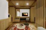 This stunning property boasts a spacious and bright living area with a cozy wooden interior.